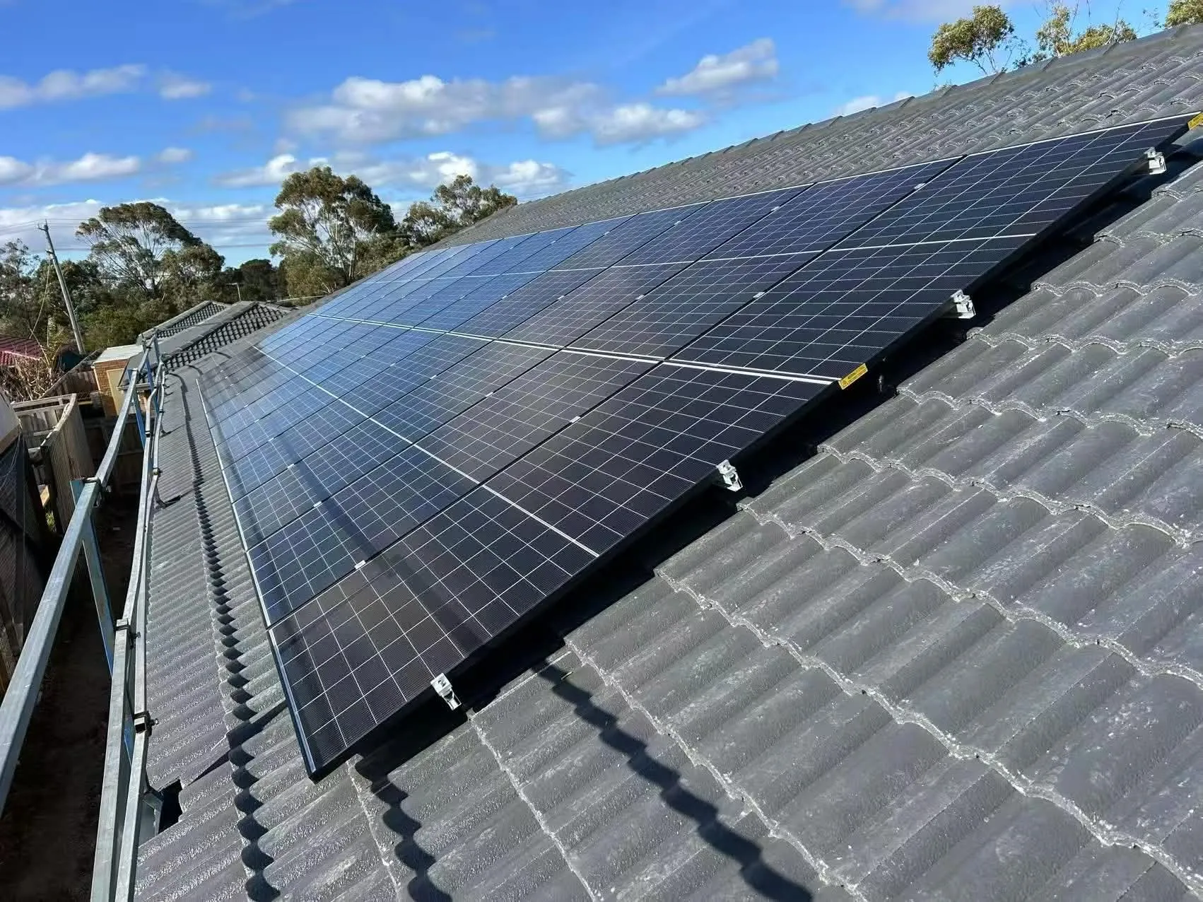 10 kW residential solar array on grey tiled roof